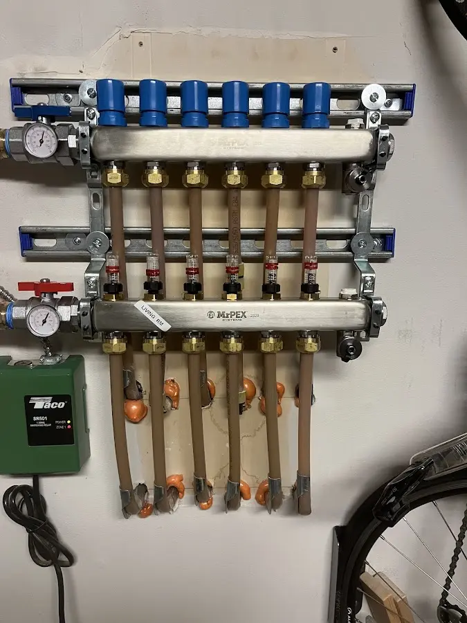 Plumber performing Water Heater Repair at a residential property in Hermon